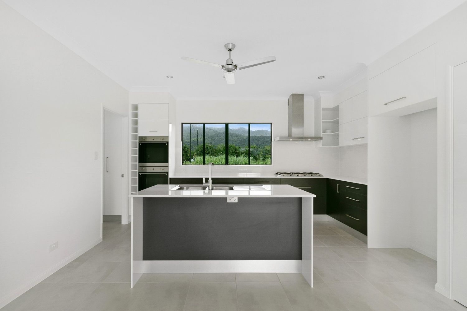 There is a Large Island in the Middle of the Kitchen — Ashlee Jones Homes in Gordonvale, QLD