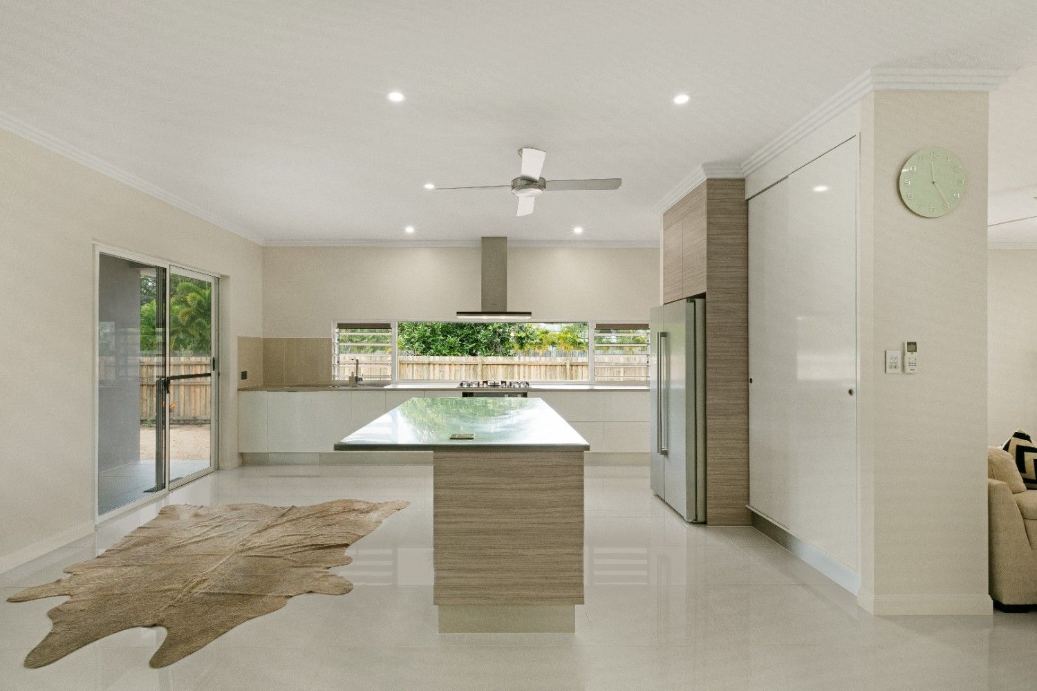 An Empty Patio With a View of a Grassy Field — Ashlee Jones Homes in Gordonvale, QLD