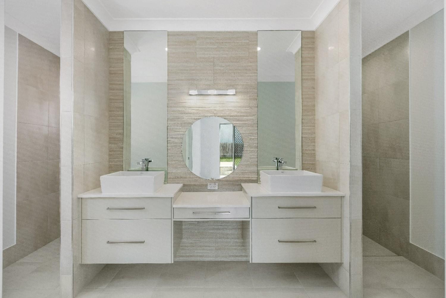 A Bathroom With Two Sinks and a Mirror — Ashlee Jones Homes in Gordonvale, QLD