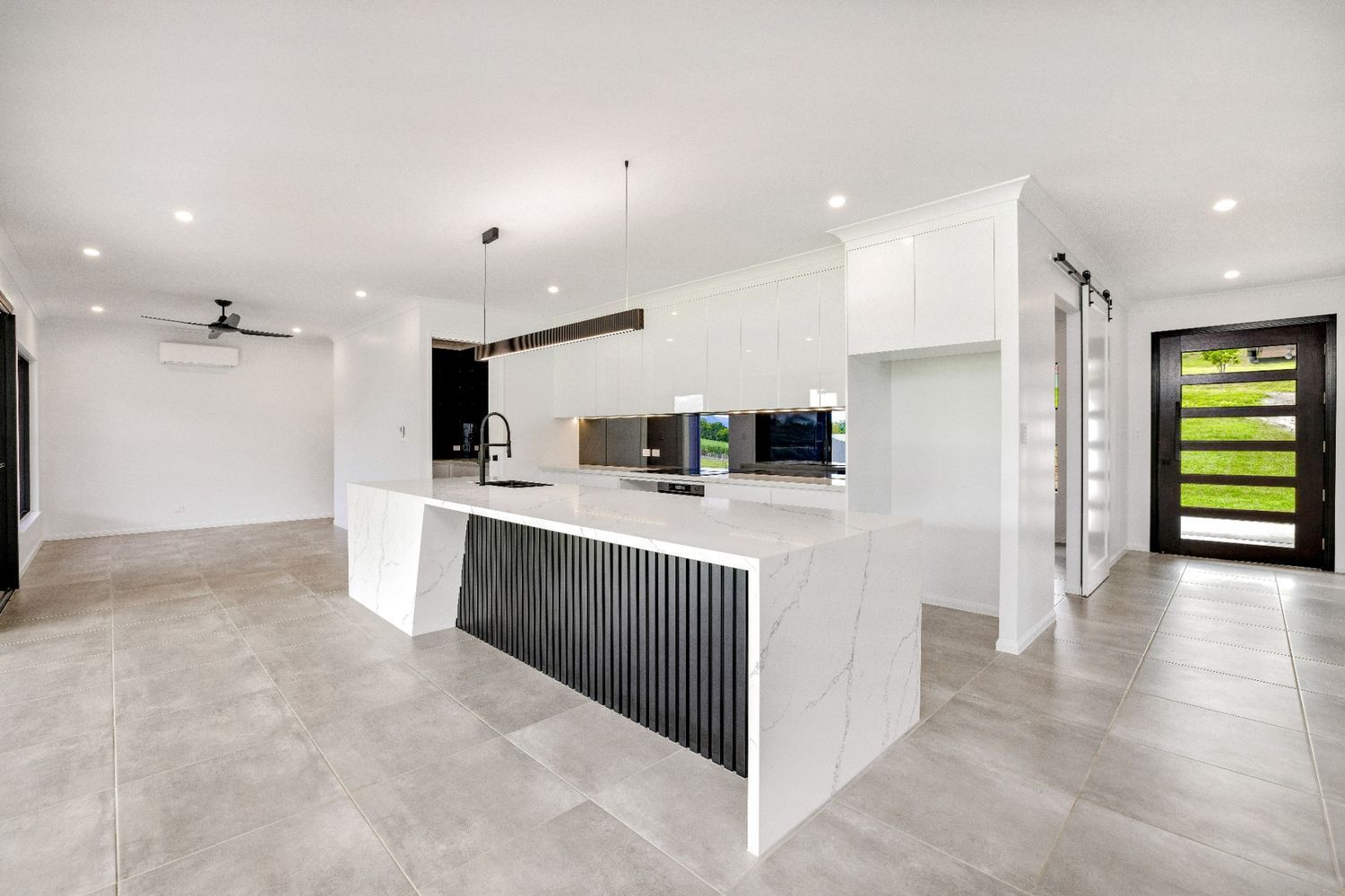There is a Large Island in the Middle of the Kitchen — Ashlee Jones Homes in Gordonvale, QLD