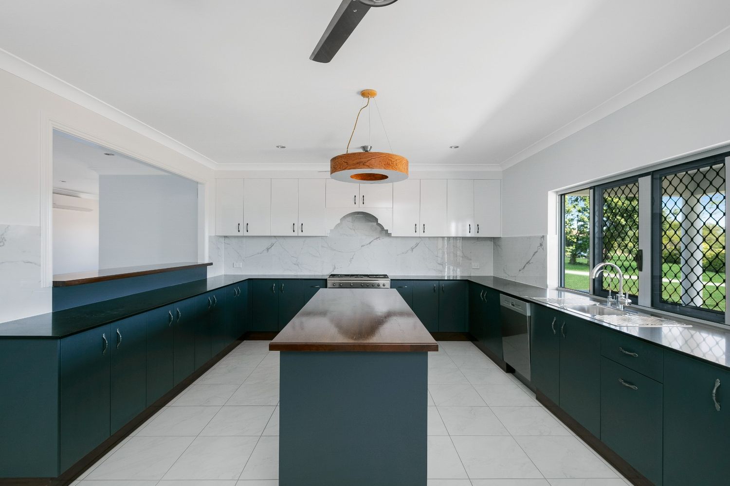 There is a Large Island in the Middle of the Kitchen — Ashlee Jones Homes in Gordonvale, QLD