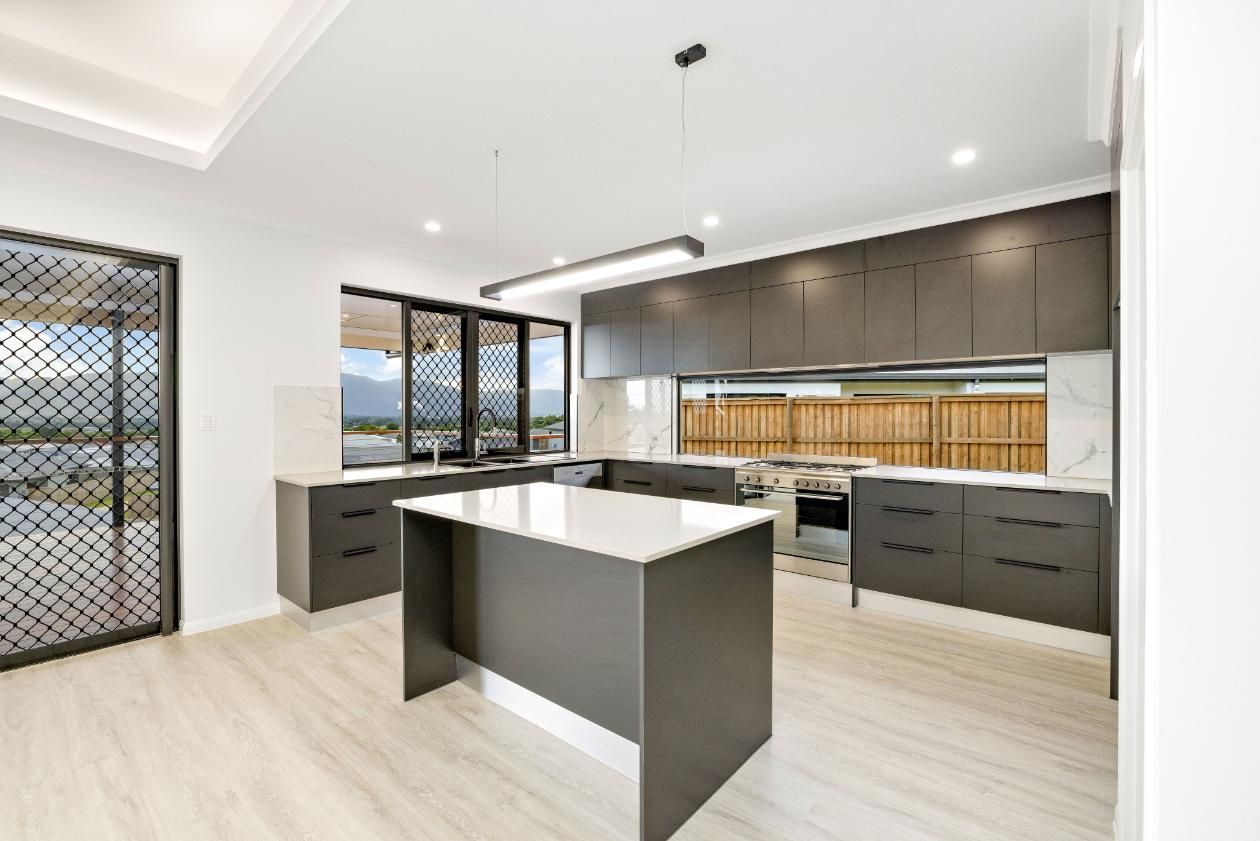 There is a Large Island in the Middle of the Kitchen — Ashlee Jones Homes in Gordonvale, QLD