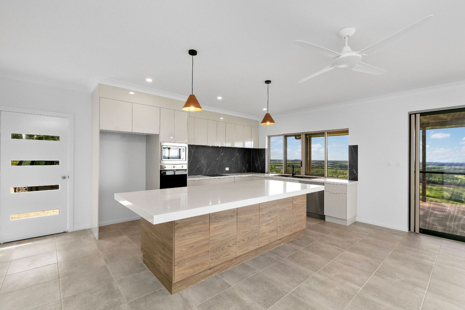There is a Large Island in the Middle of the Kitchen — Ashlee Jones Homes in Gordonvale, QLD