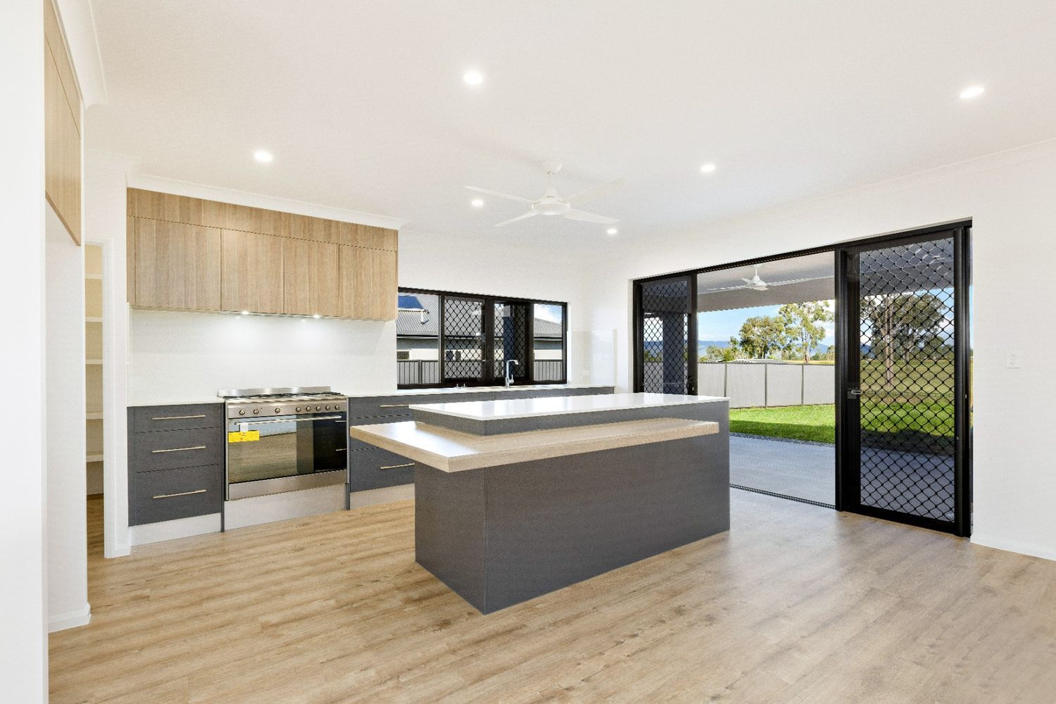 There is a Large Island in the Middle of the Kitchen — Ashlee Jones Homes in Gordonvale, QLD