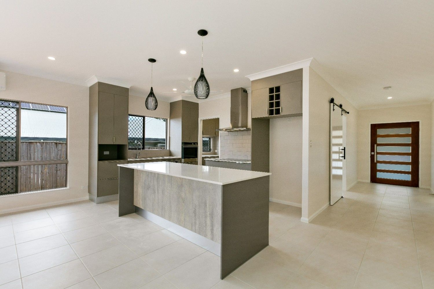 There is a Large Island in the Middle of the Kitchen — Ashlee Jones Homes in Gordonvale, QLD