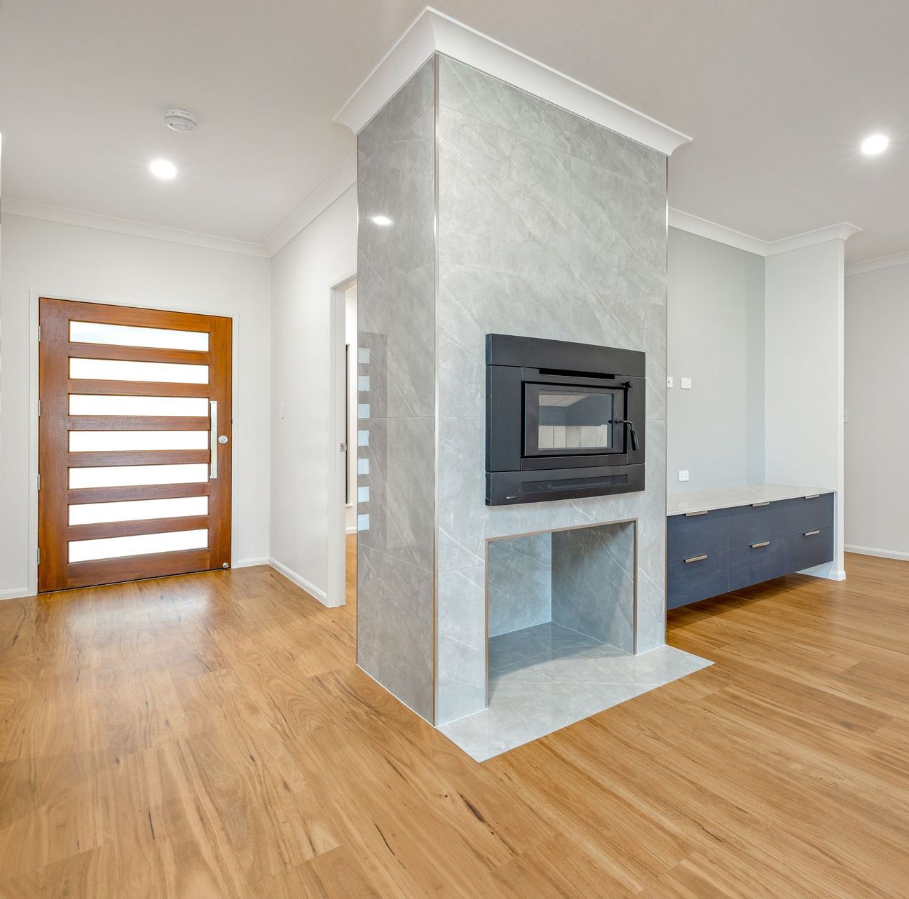 A Bathroom With A Sink, Mirror And Drawers — Ashlee Jones Homes in Gordonvale, QLD