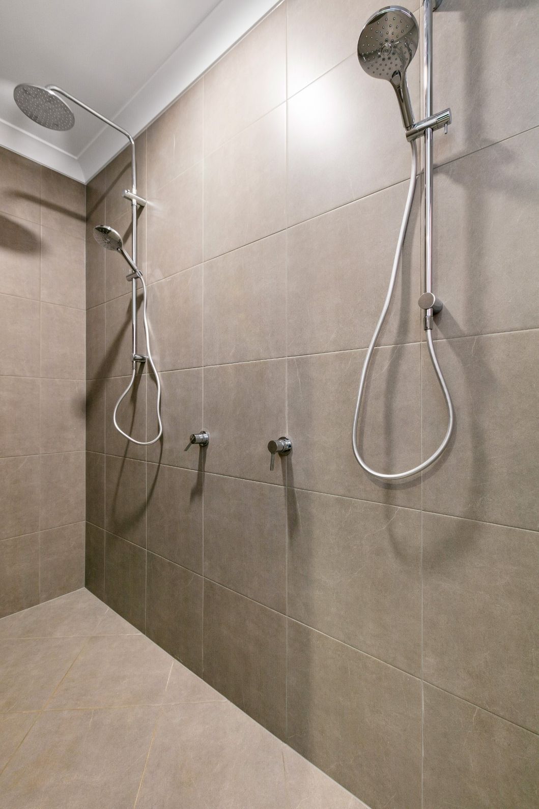 A Shower With Two Shower Heads on the Wall — Ashlee Jones Homes in Gordonvale, QLD