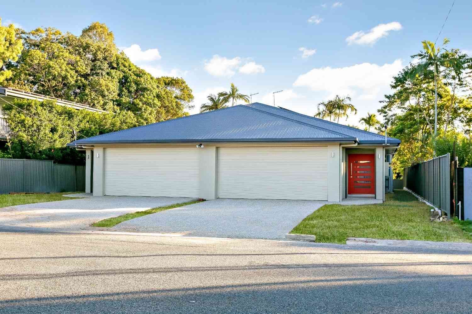 A White House With a Blue Roof and a Red Door — Ashlee Jones Homes in Gordonvale, QLD
