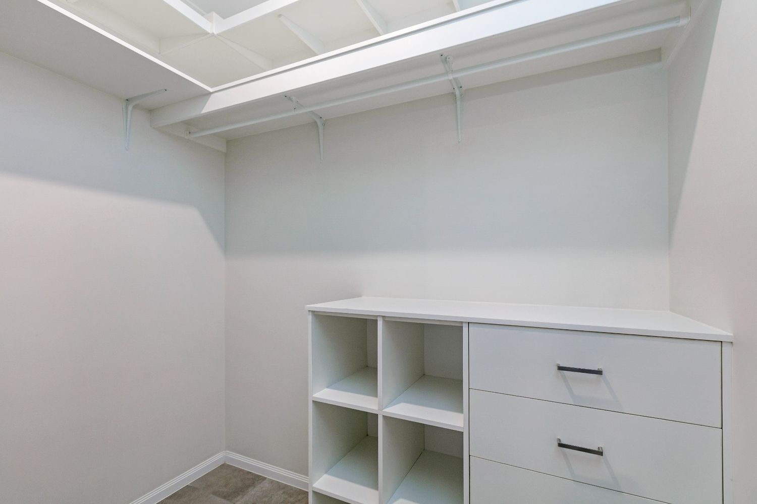 A Walk in Closet With Lots of Shelves and Drawers — Ashlee Jones Homes in Gordonvale, QLD