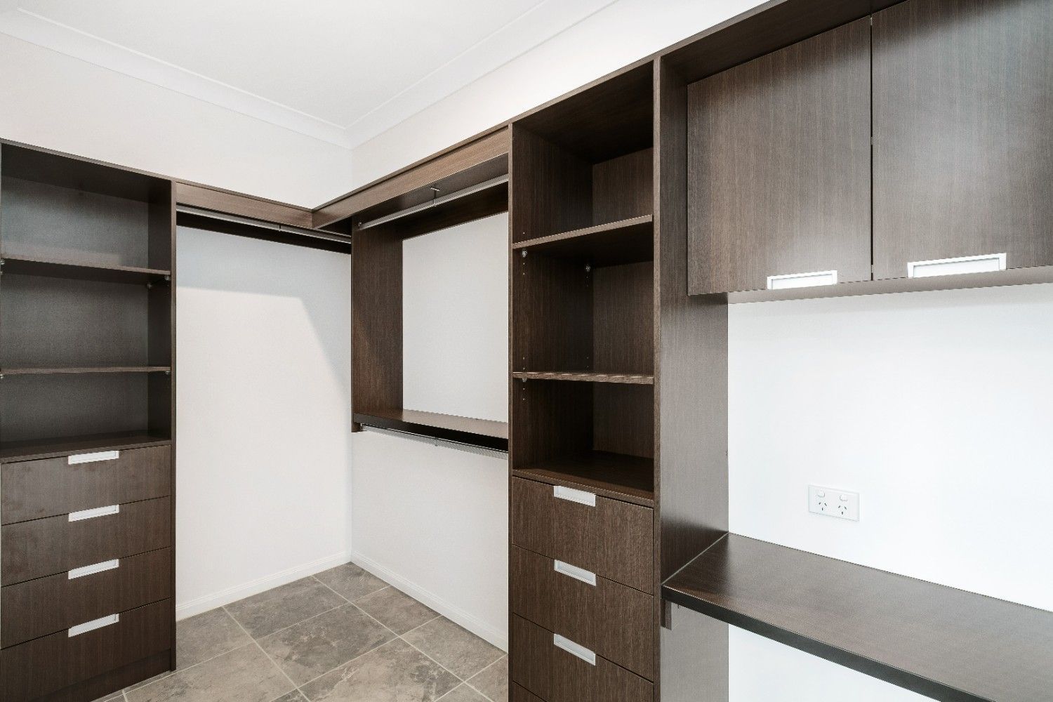 A Walk in Closet With Lots of Shelves and Drawers — Ashlee Jones Homes in Gordonvale, QLD