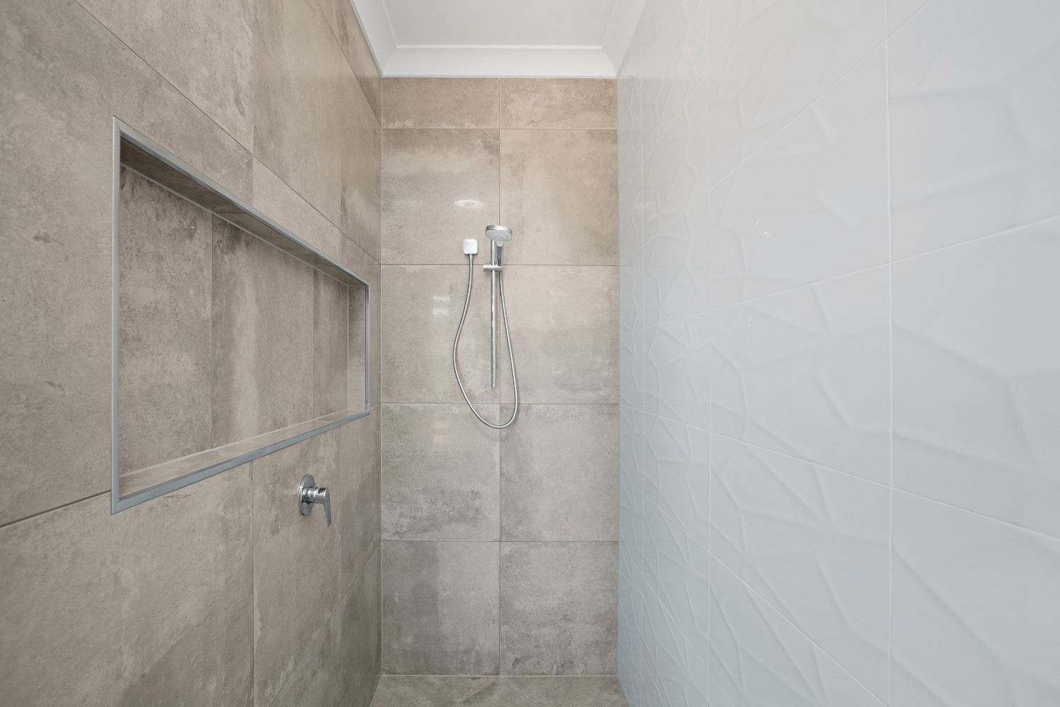 A Bathroom With a Shower and a Niche in the Wall — Ashlee Jones Homes in Gordonvale, QLD