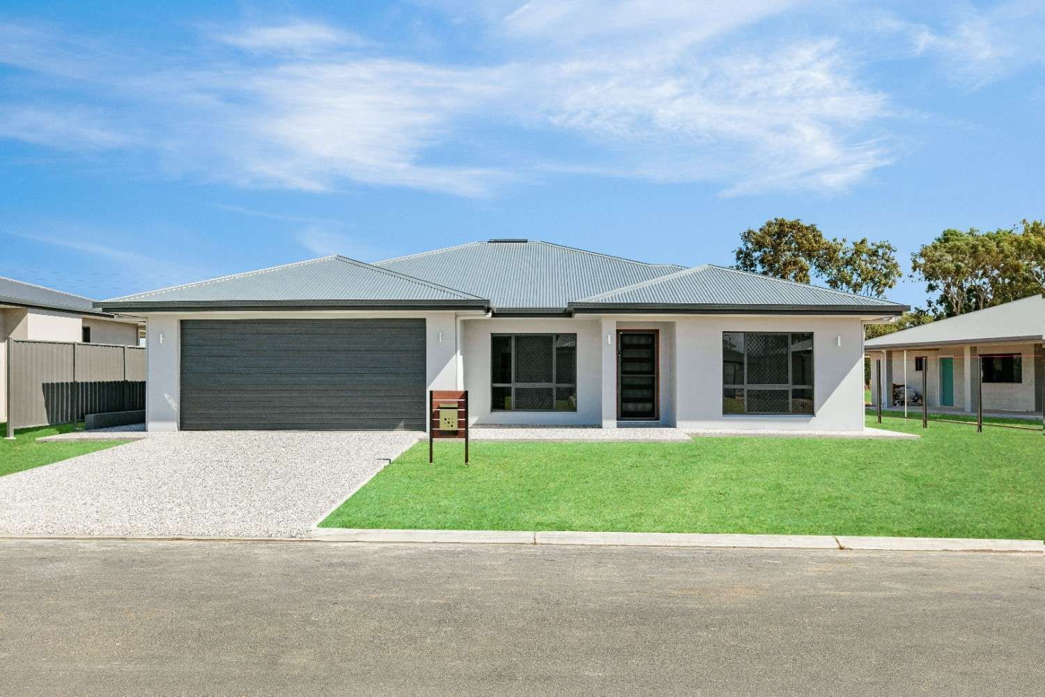 A House With a Sign in Front of It That Says for Sale — Ashlee Jones Homes in Gordonvale, QLD
