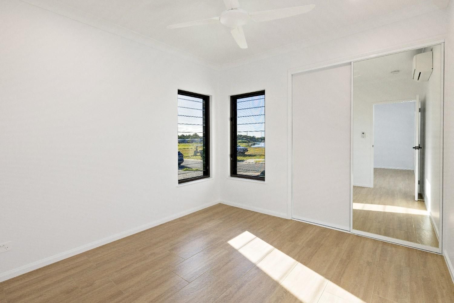 There is a Large Mirror in the Middle of the Room — Ashlee Jones Homes in Gordonvale, QLD
