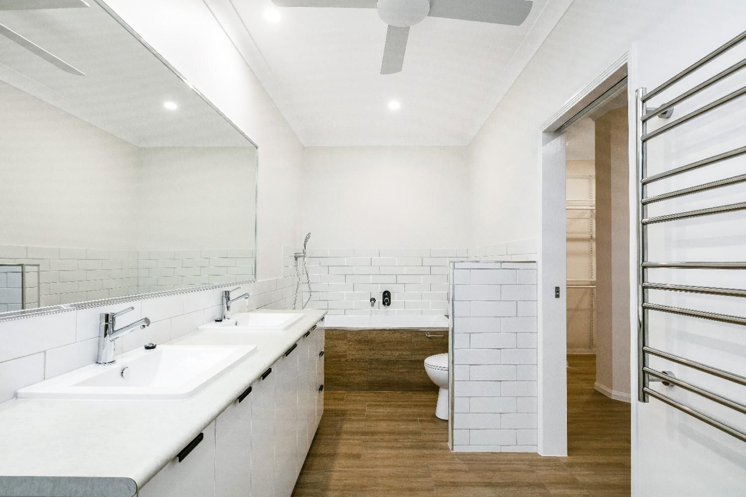 A Bathroom With Two Sinks — Ashlee Jones Homes in Gordonvale, QLD