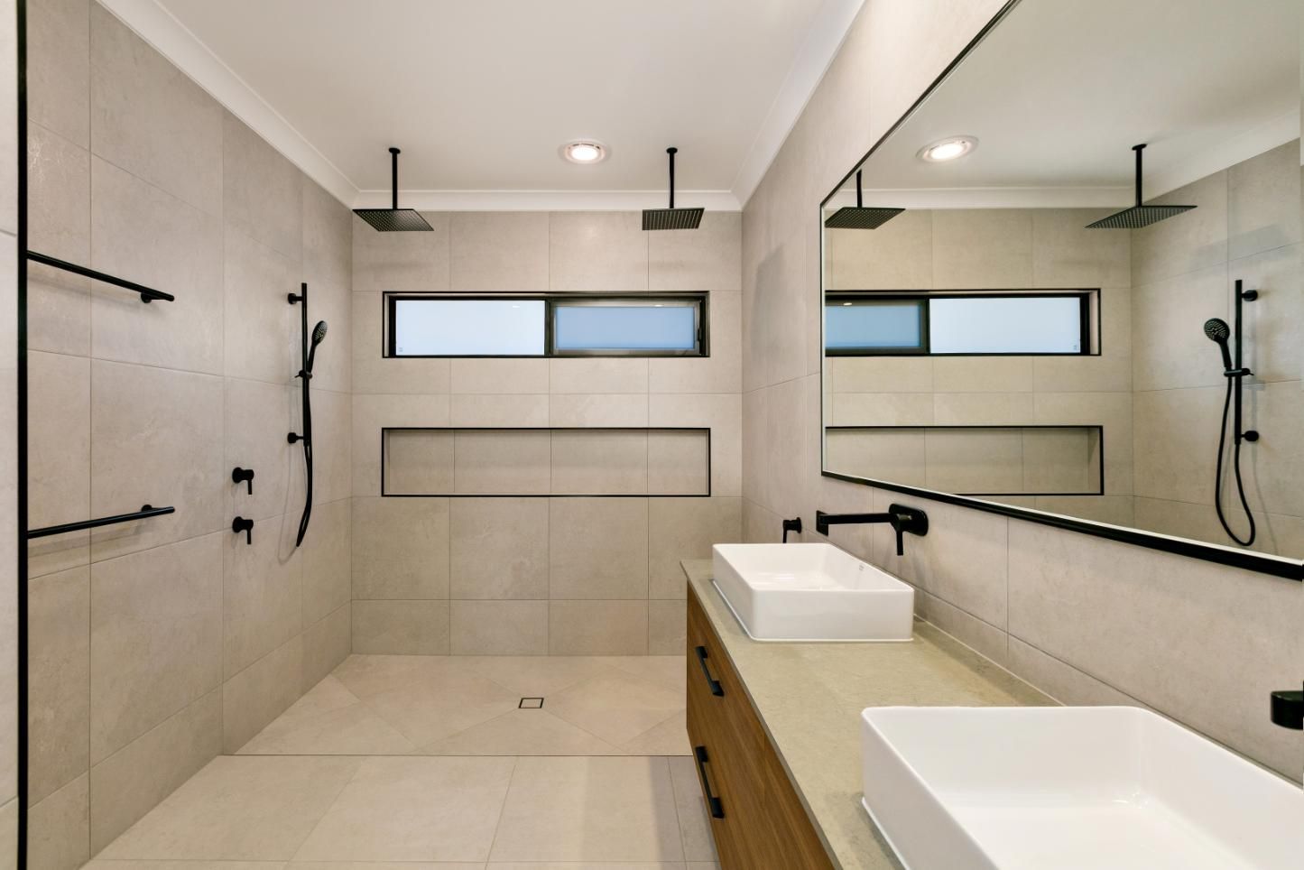 A Bathroom With Two Sinks and a Walk in Shower — Ashlee Jones Homes in Gordonvale, QLD