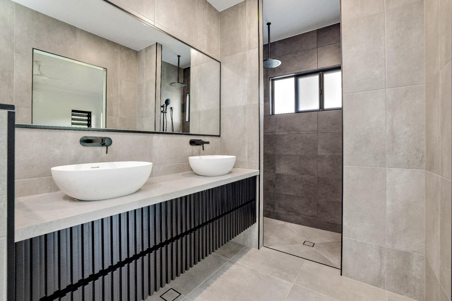A Bathroom With Two Sinks and a Walk in Shower — Ashlee Jones Homes in Gordonvale, QLD