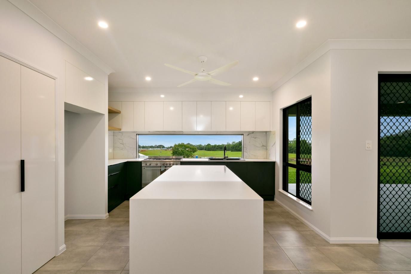 There is a Large Island in the Middle of the Kitchen — Ashlee Jones Homes in Gordonvale, QLD