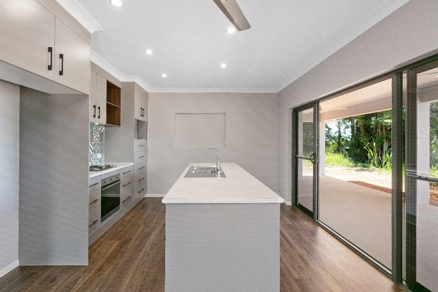 There is a Large Island in the Middle of the Kitchen — Ashlee Jones Homes in Gordonvale, QLD