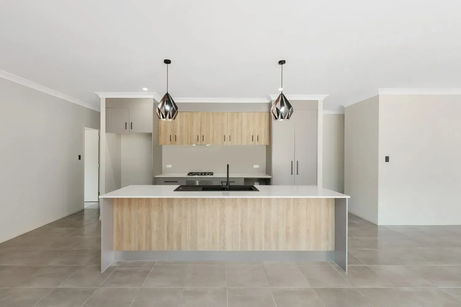 A Large House is Sitting on Top of a Lush Green Field — Ashlee Jones Homes in Gordonvale, QLD