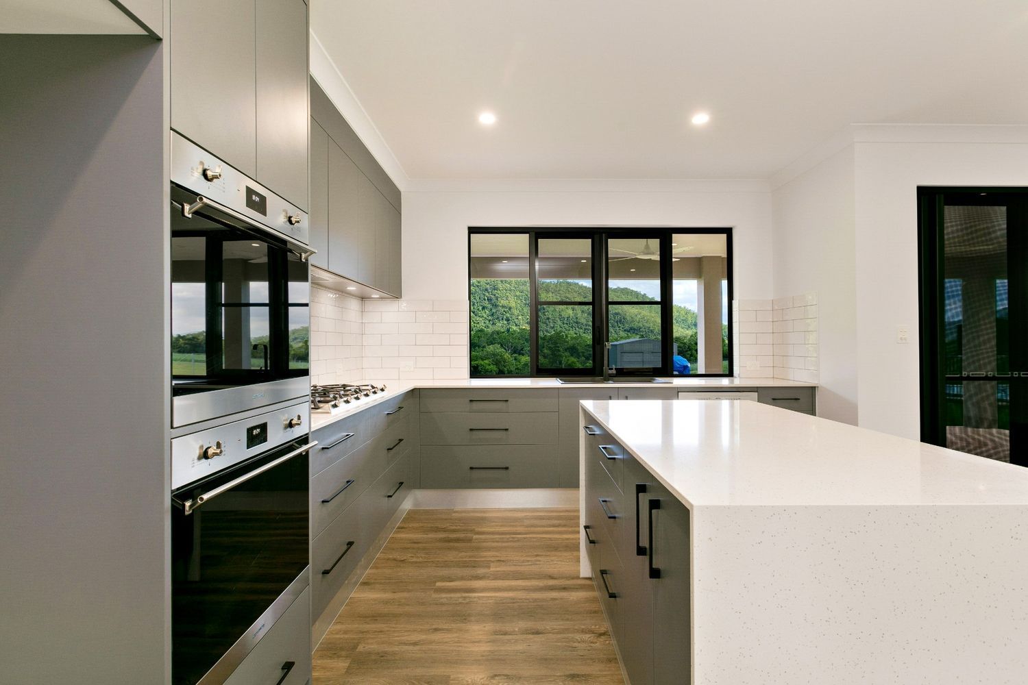 There is a Large Island in the Middle of the Kitchen — Ashlee Jones Homes in Gordonvale, QLD
