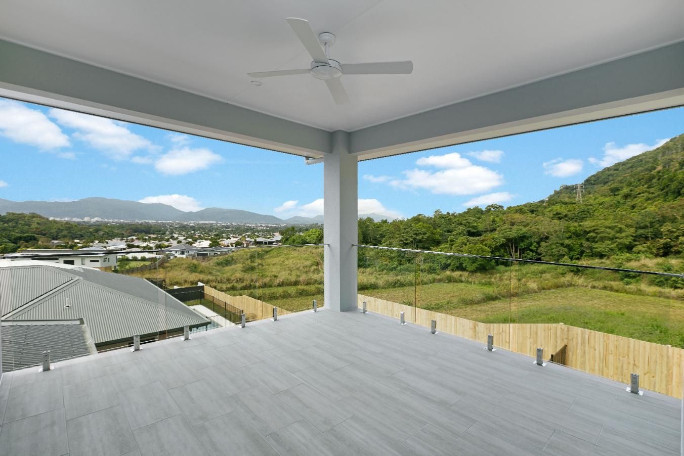 There is a Ceiling Fan on the Balcony With a View of the Mountains — Ashlee Jones Homes in Gordonvale, QLD