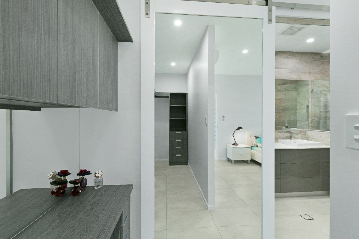 A Hallway in a House With a Large Mirror on the Wall — Ashlee Jones Homes in Gordonvale, QLD