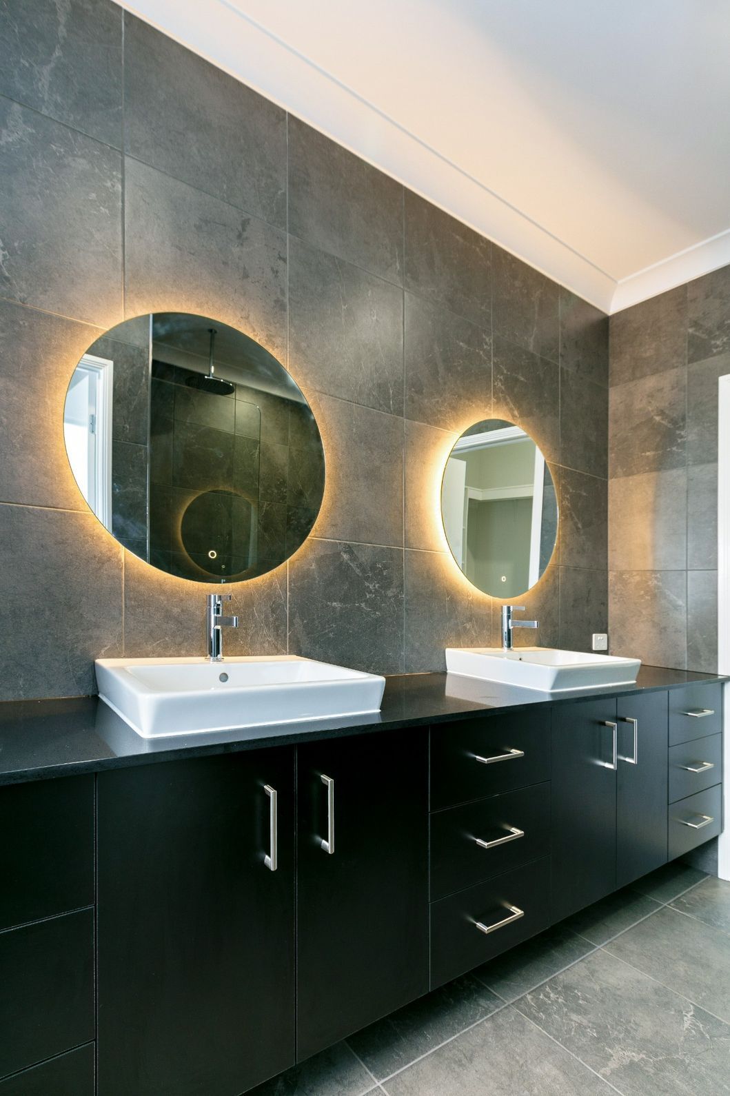 A Bathroom With Two Sinks and Two Mirrors — Ashlee Jones Homes in Gordonvale, QLD