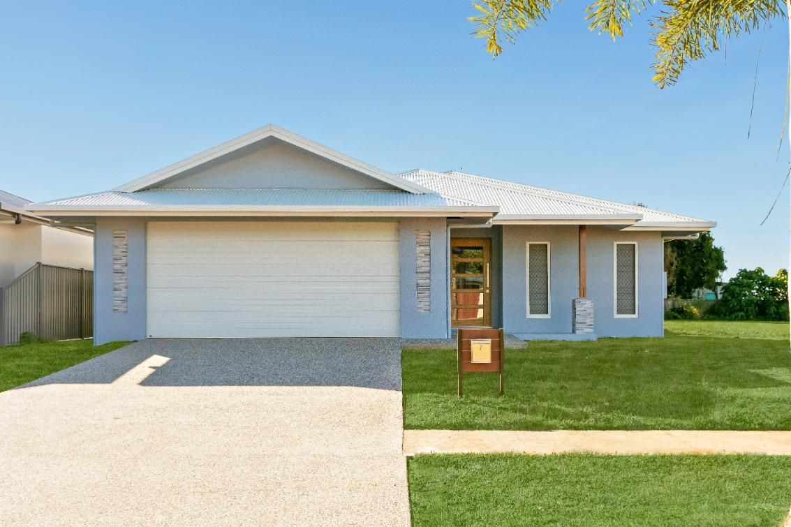A Blue House With a White Garage Door is for Sale — Ashlee Jones Homes in Gordonvale, QLD
