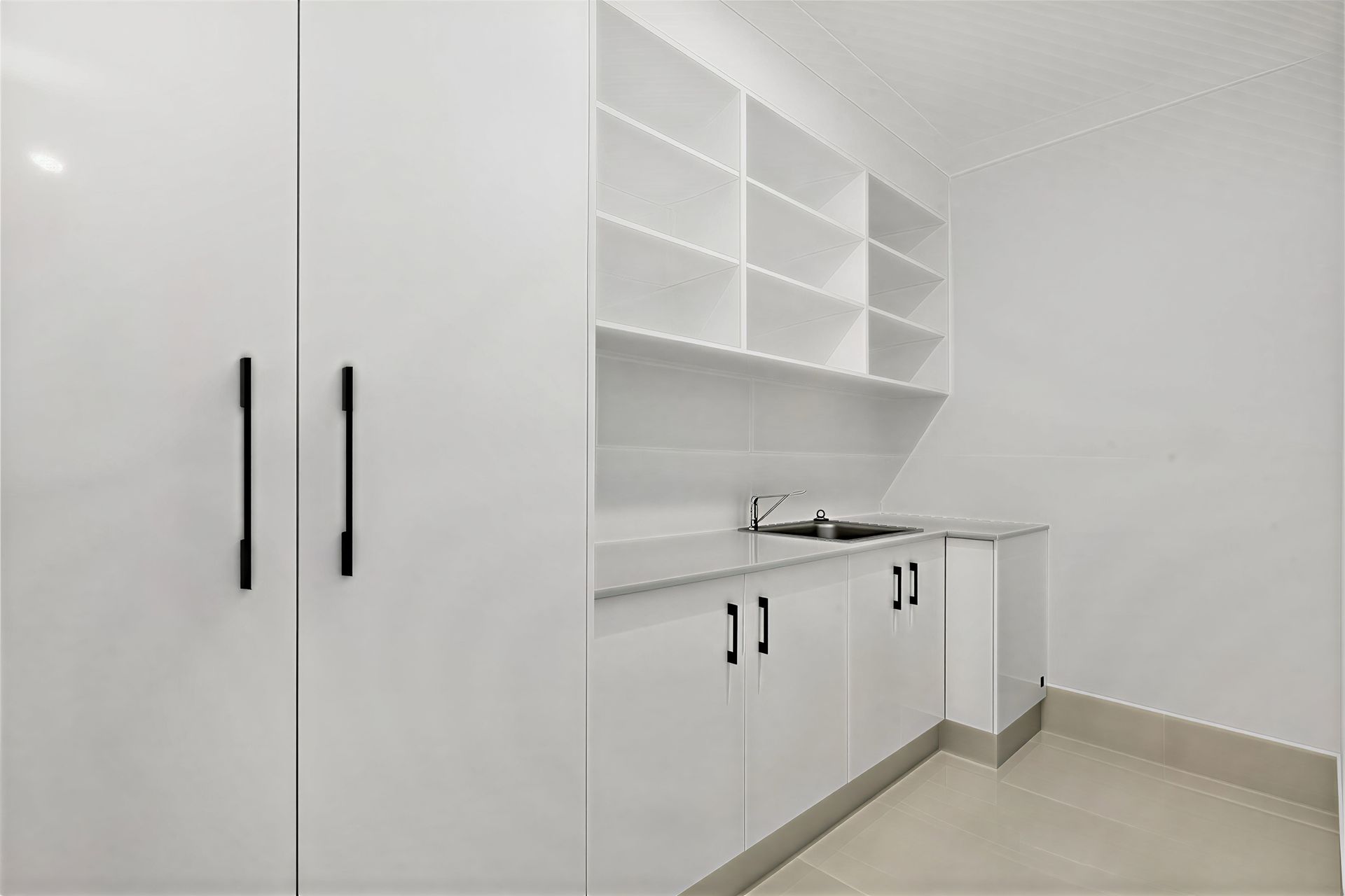 A Kitchen With White Cabinets and Shelves and a Sink — Ashlee Jones Homes in Gordonvale, QLD
