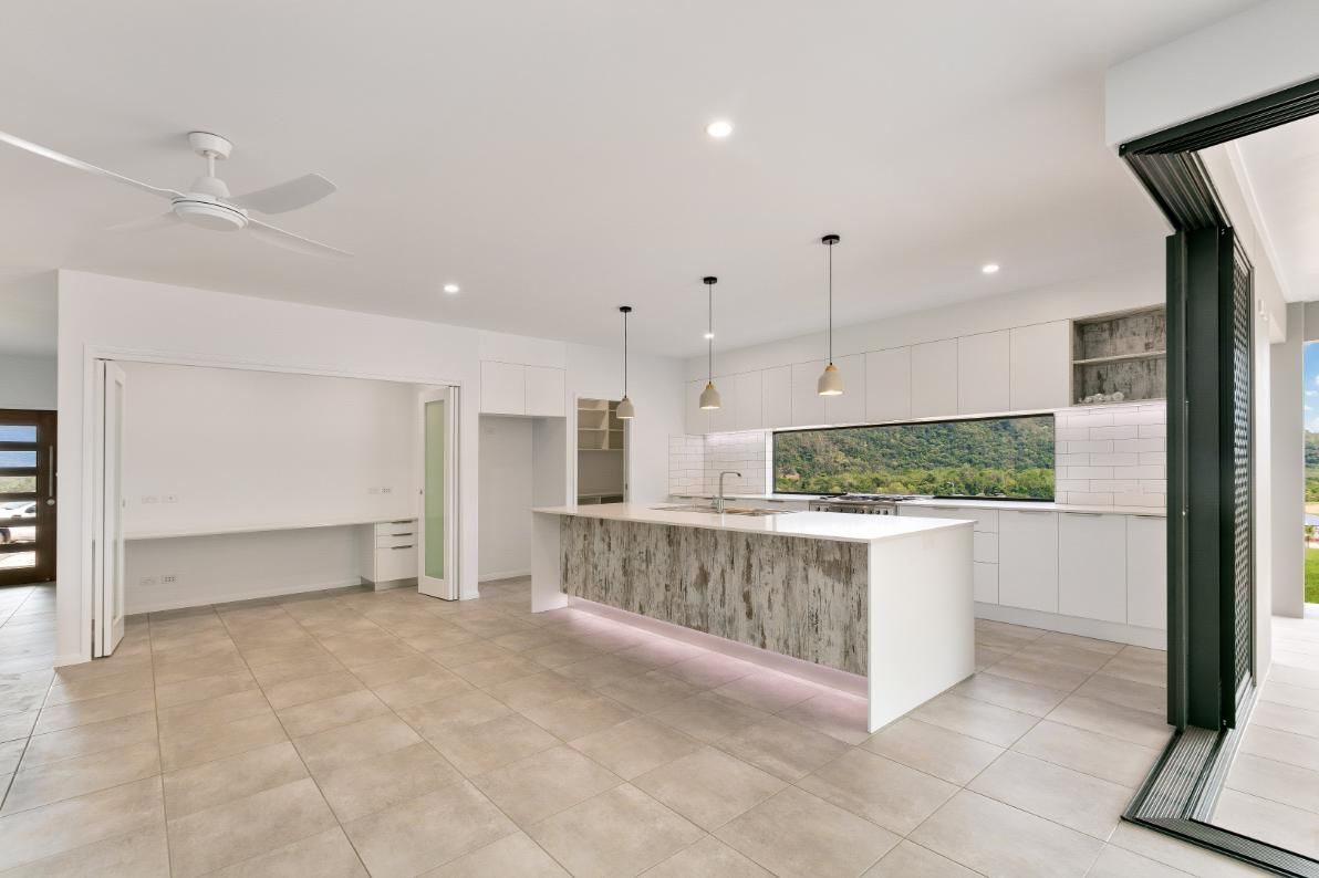 There is a Large Island in the Middle of the Kitchen — Ashlee Jones Homes in Gordonvale, QLD