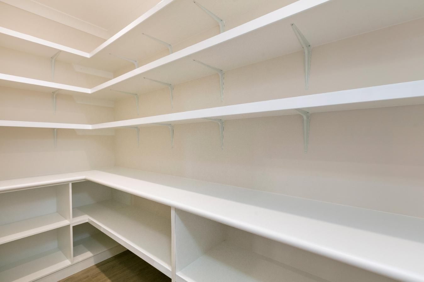 A Walk in Pantry With Empty Shelves in a House — Ashlee Jones Homes in Gordonvale, QLD