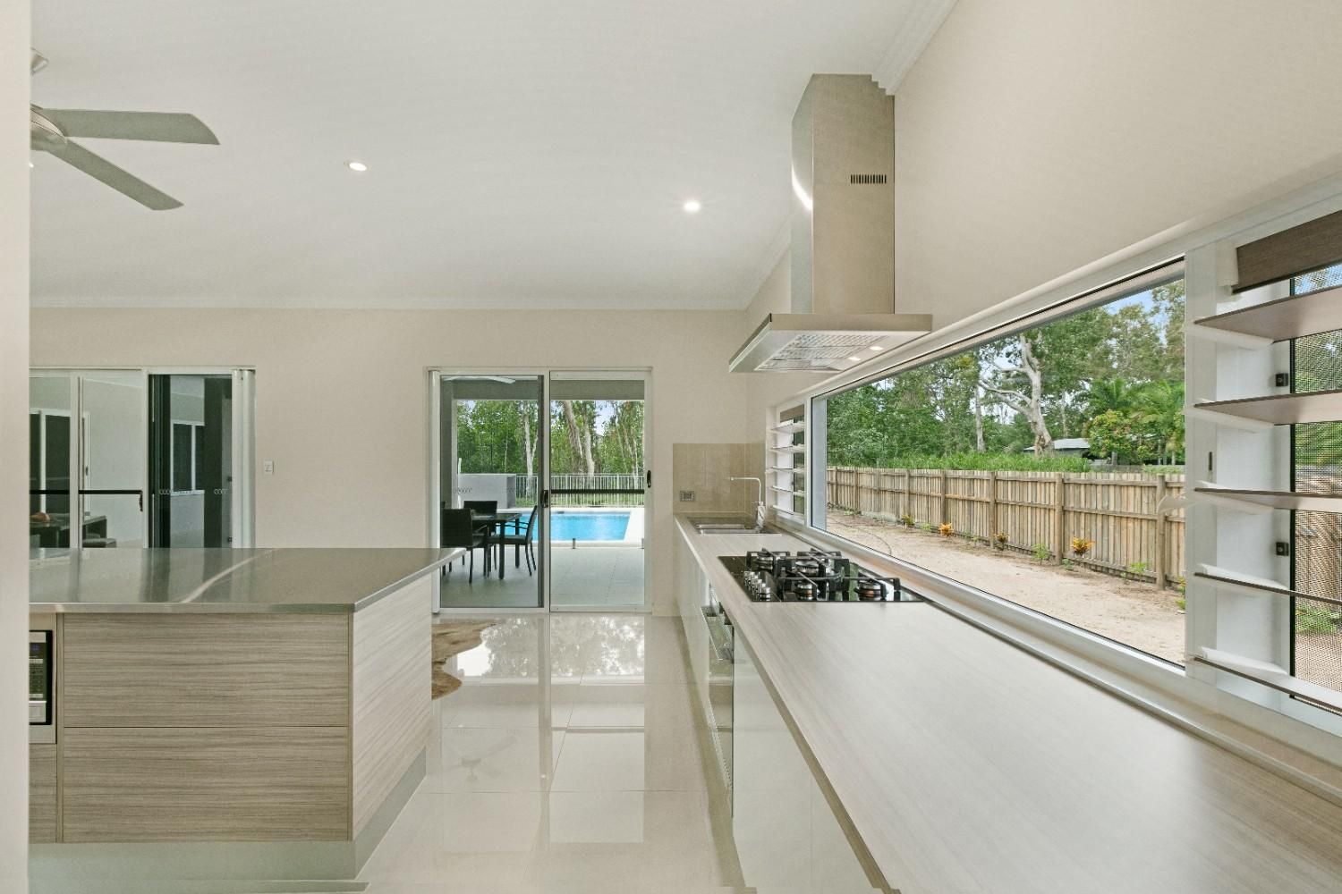 A Bathroom With Two Sinks and a Walk in Shower — Ashlee Jones Homes in Gordonvale, QLD