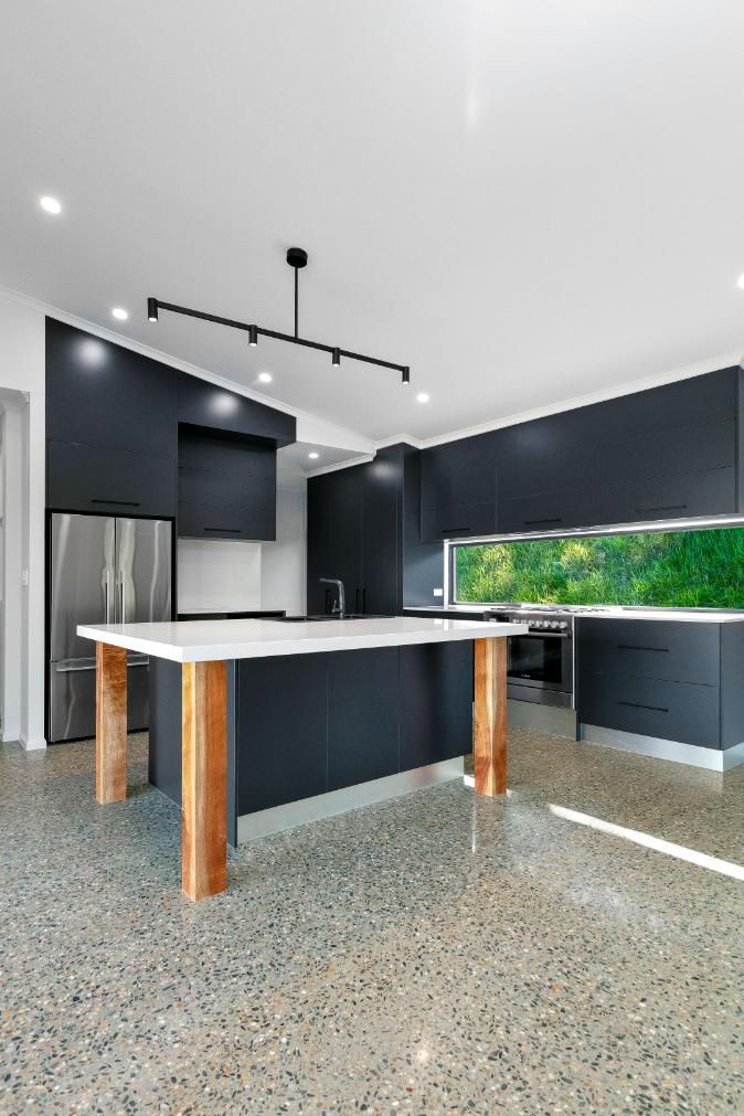 There is a Large Island in the Middle of the Kitchen — Ashlee Jones Homes in Gordonvale, QLD