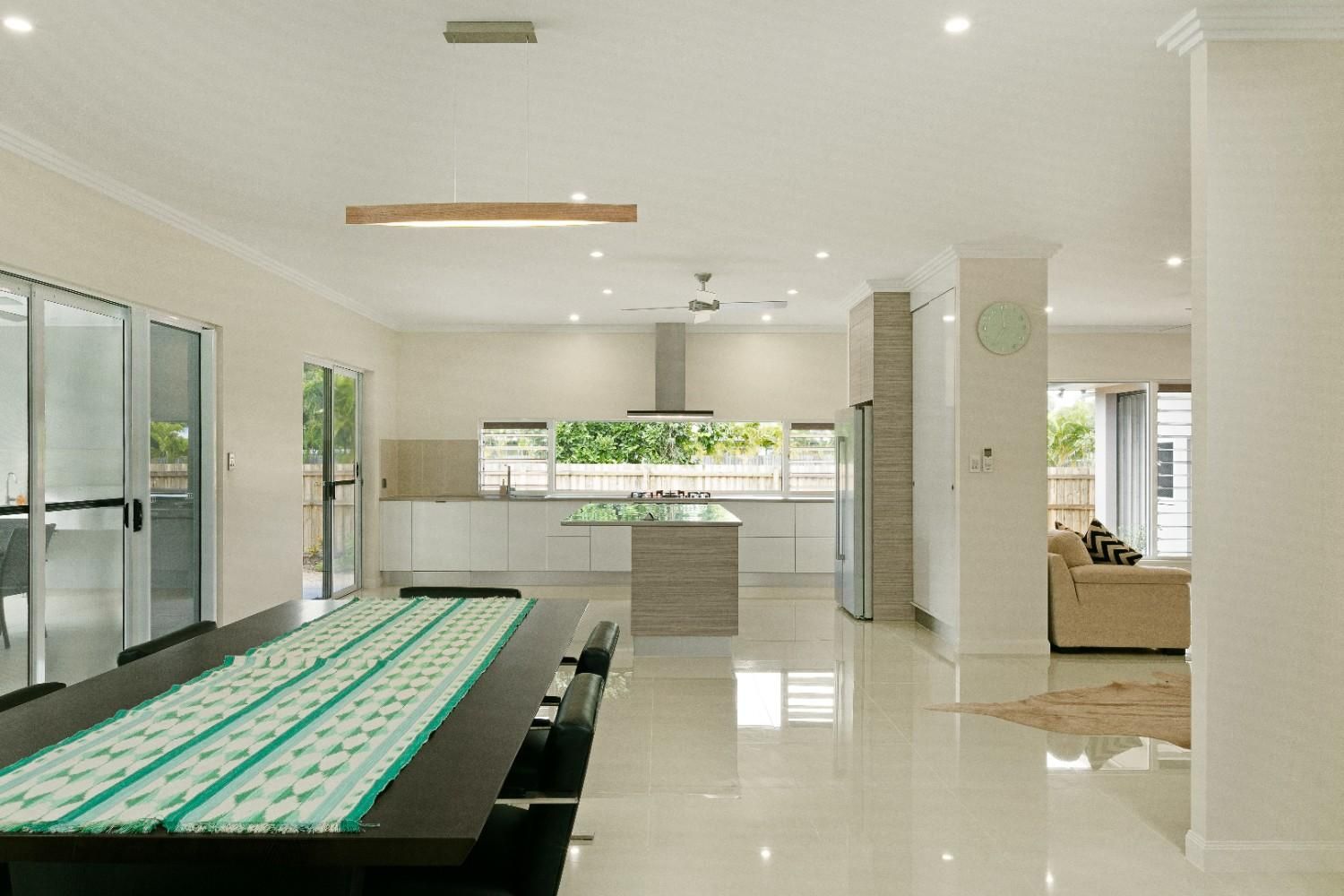 A Bathroom With a Sink and a Window Next to a Bedroom — Ashlee Jones Homes in Gordonvale, QLD