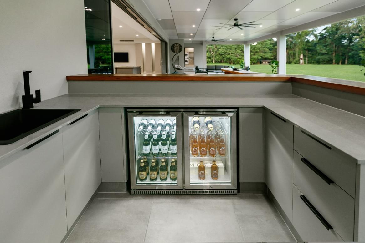 A Kitchen With a Refrigerator and a Sink — Ashlee Jones Homes in Gordonvale, QLD