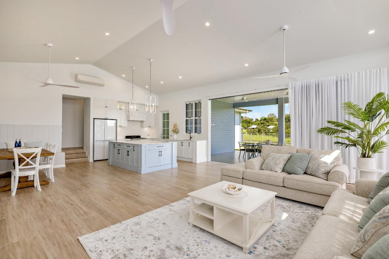 A Living Room With a Couch and a Coffee Table in a House — Ashlee Jones Homes in Gordonvale, QLD