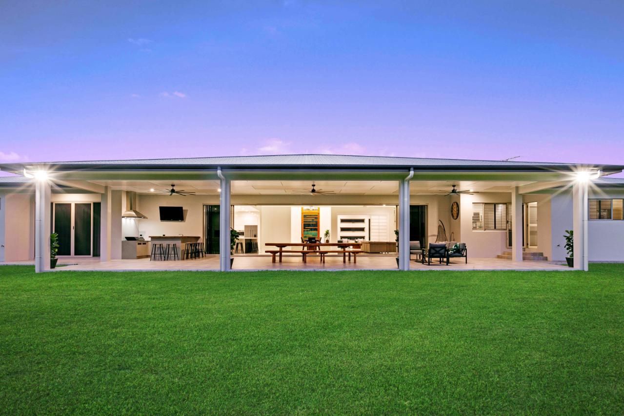 A Large House With a Large Lawn in Front of It — Ashlee Jones Homes in Gordonvale, QLD