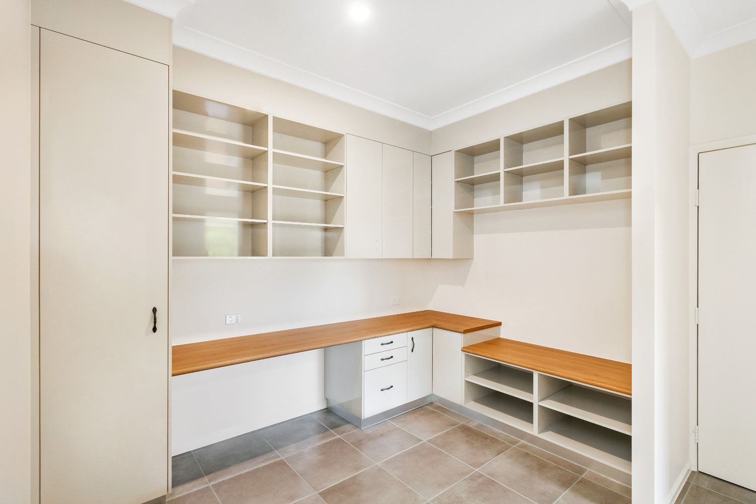 A Room With a Desk and Shelves in It — Ashlee Jones Homes in Gordonvale, QLD