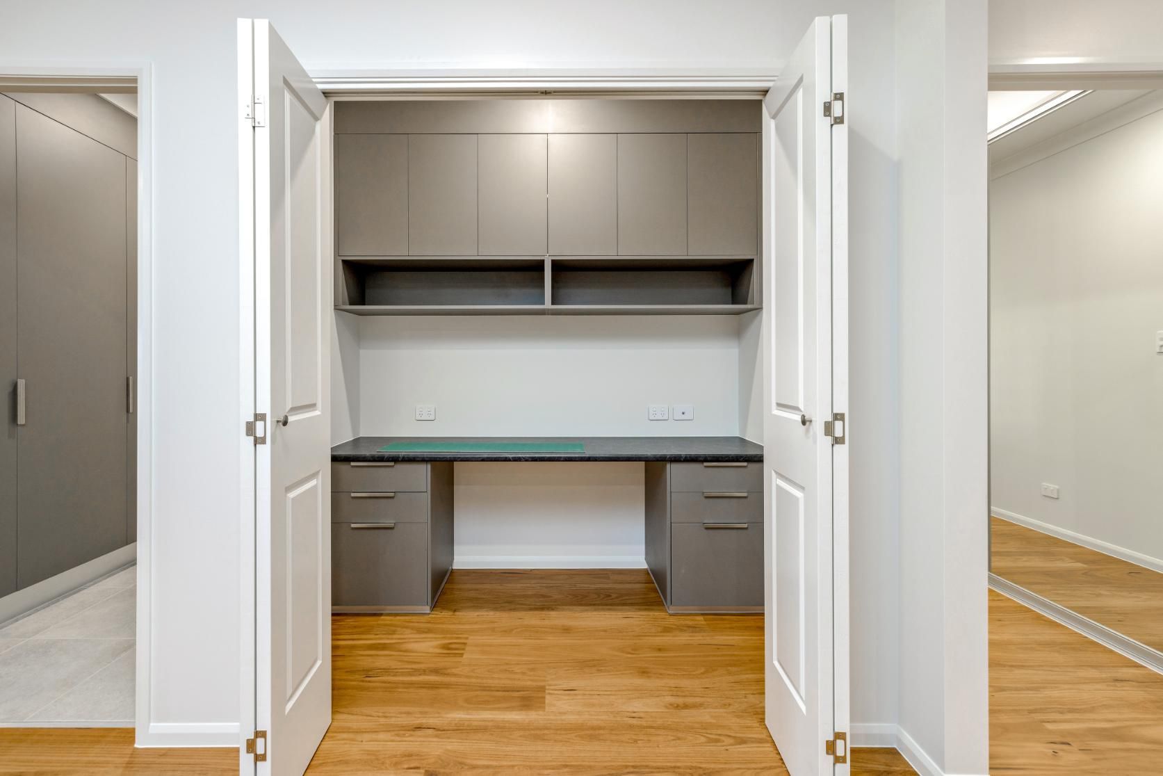 There is a Desk in the Closet With the Doors Open — Ashlee Jones Homes in Gordonvale, QLD