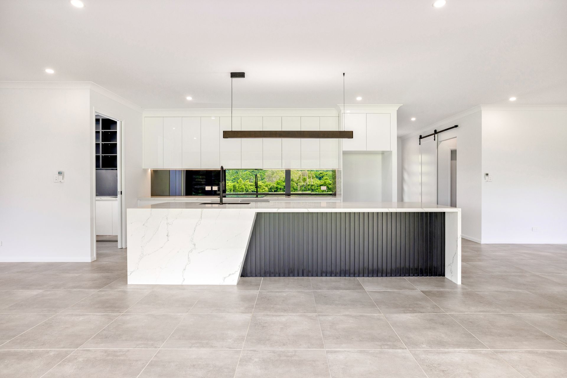 A Bathroom With A Bathtub, Sinks, Mirrors And A Walk In Shower — Ashlee Jones Homes in Gordonvale, QLD