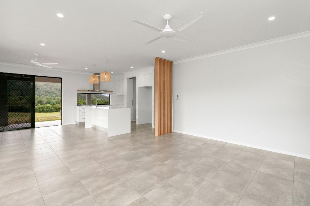 There is a Ceiling Fan in the Living Room of a House — Ashlee Jones Homes in Gordonvale, QLD
