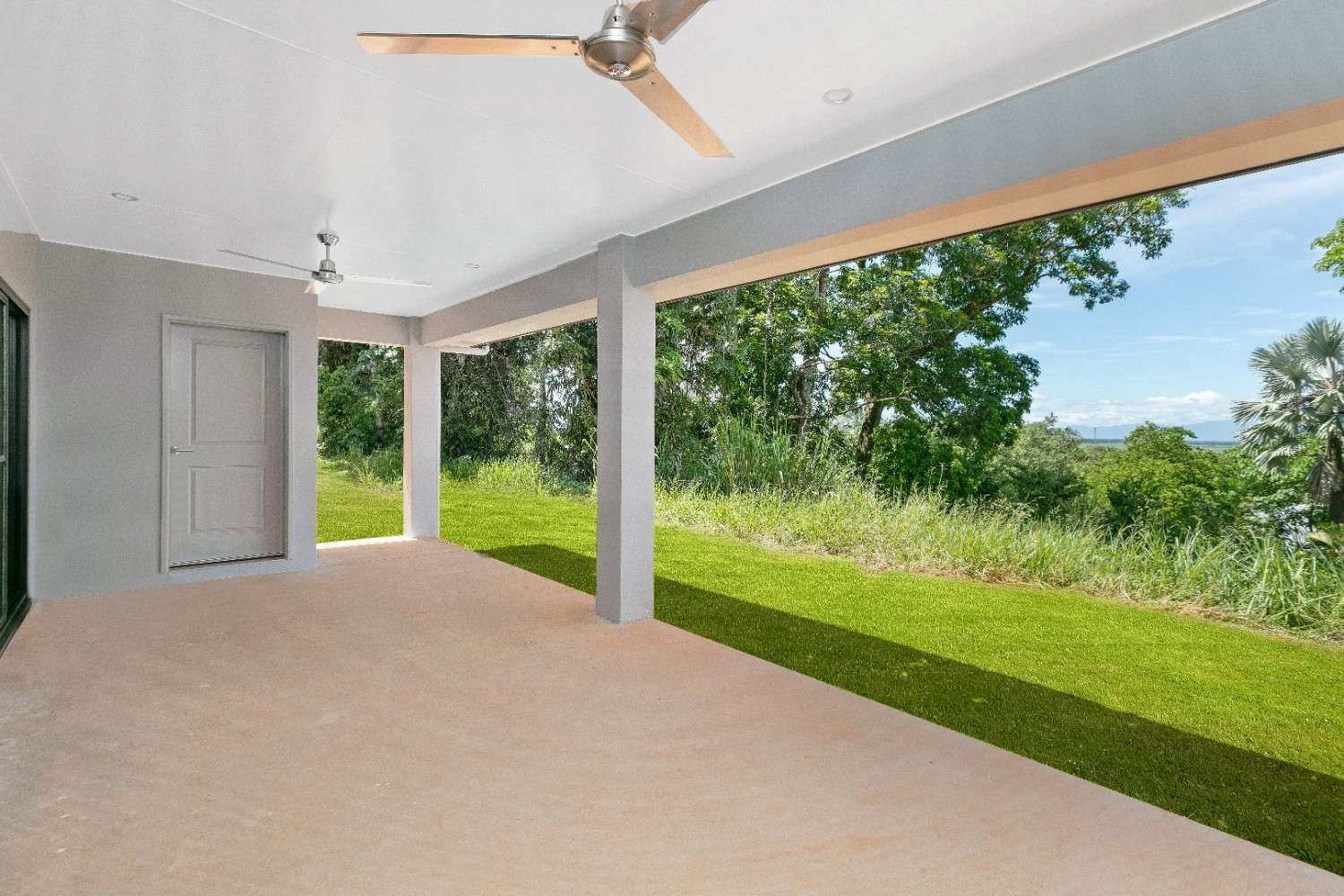 There is a Ceiling Fan on the Porch of a House — Ashlee Jones Homes in Gordonvale, QLD