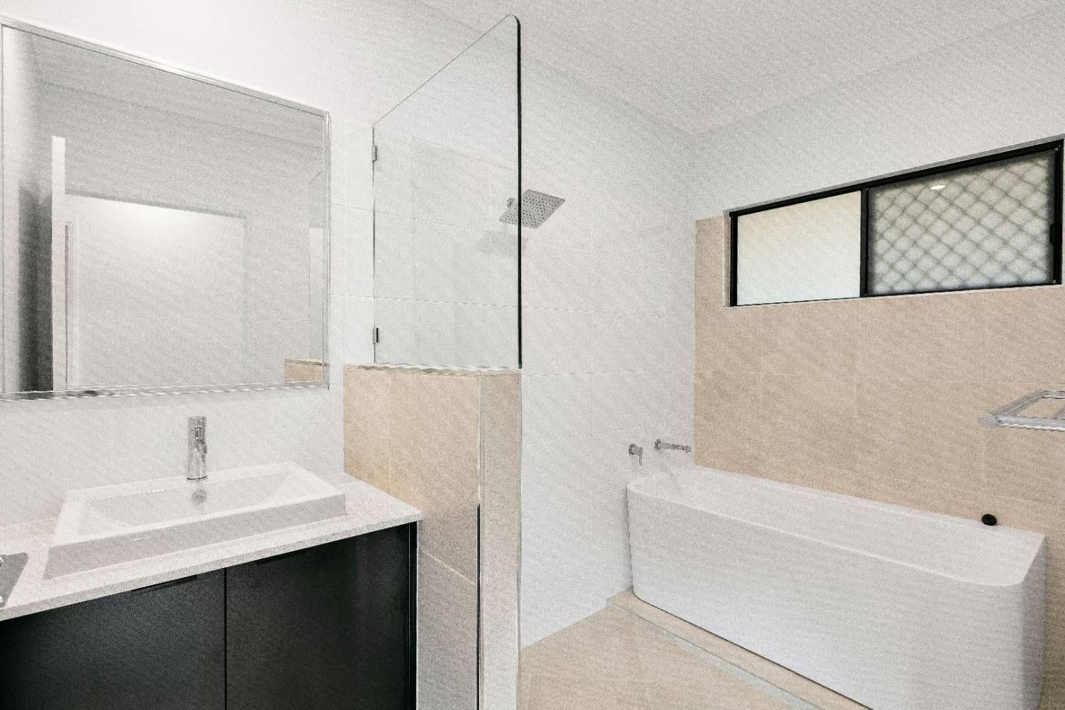 A Bathroom With a Bathtub, Sink, Mirror and Shower — Ashlee Jones Homes in Gordonvale, QLD