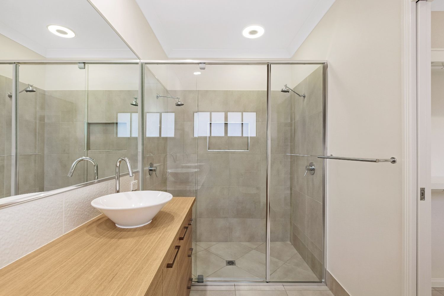 A Bathroom With a Sink and a Walk in Shower — Ashlee Jones Homes in Gordonvale, QLD