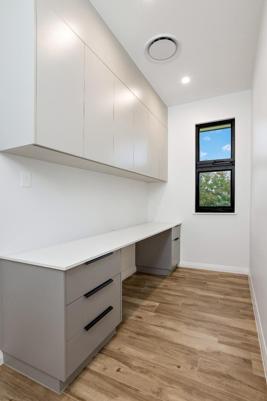 There is a Desk in the Middle of the Room With a Window — Ashlee Jones Homes in Gordonvale, QLD