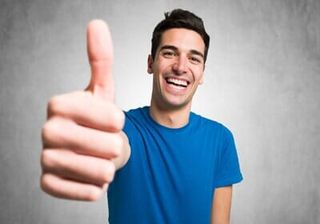 Man Thumbs-up While Smiling — Orthodontist in Fresno, CA