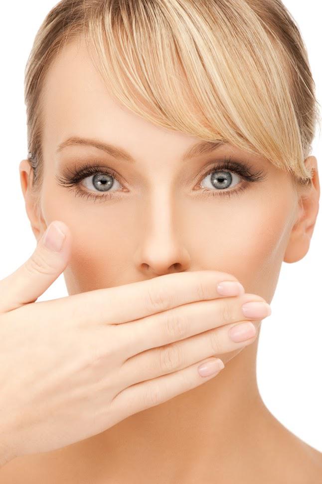 Dental — Woman Covering her Mouth in Fresno, CA