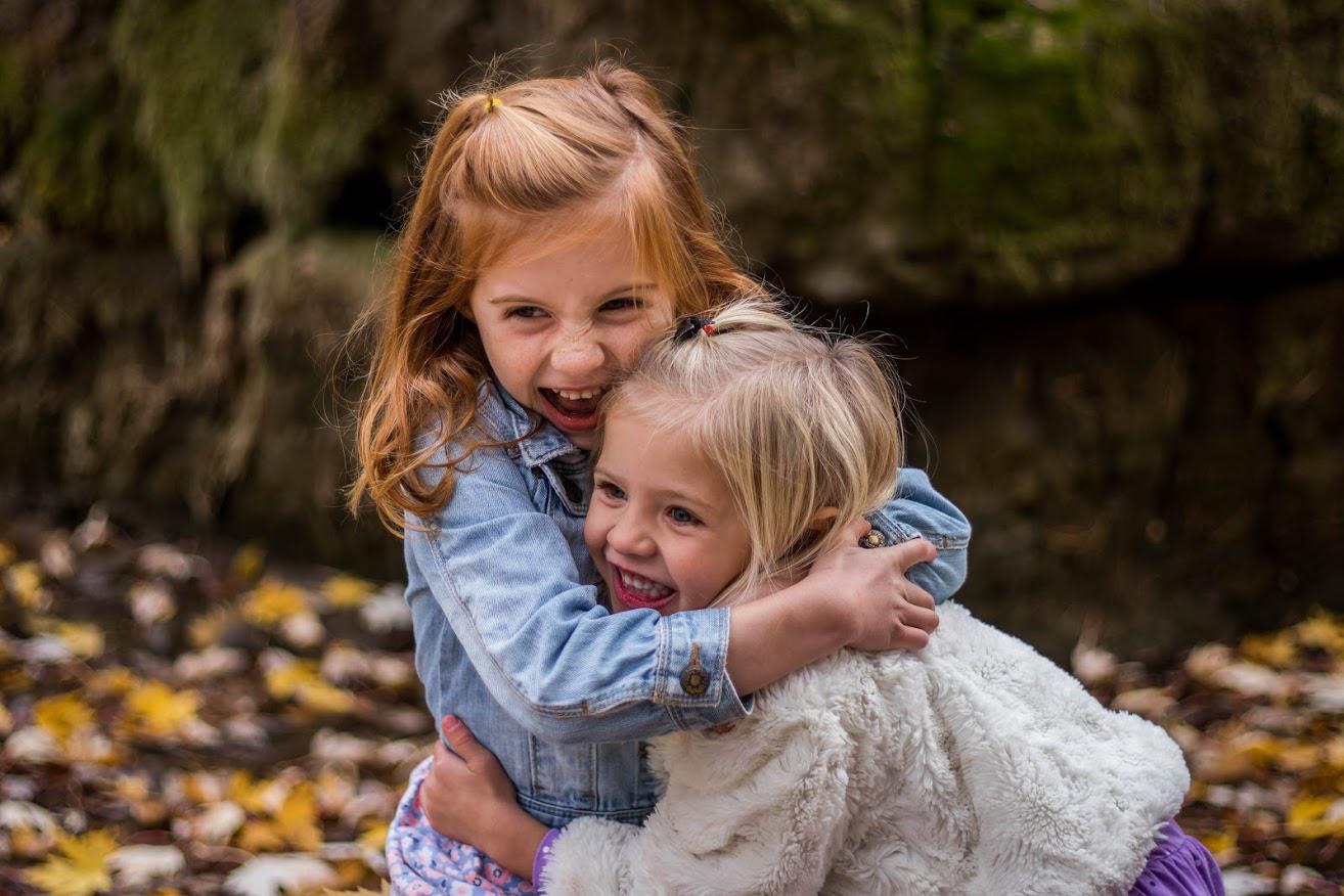 Dental Braces — Two Kids Hugging Each Other in Fresno, CA