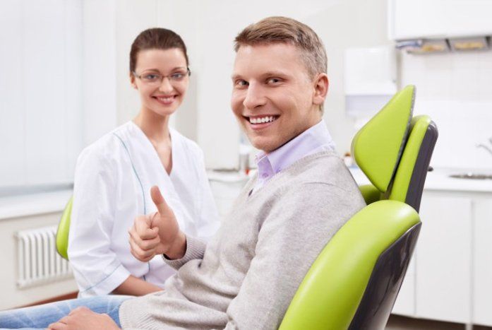 Braces — Happy Patient Talking With Dentist in Fresno, CA