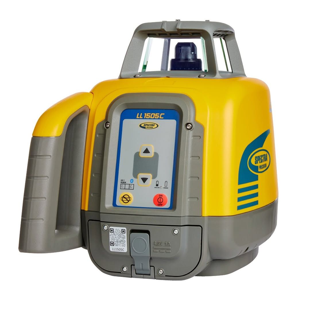 Yellow and gray rotating laser level with a control panel and carrying handle.